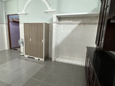 The room is wide, in the Bình Lợi villa, full of furniture, right on the ground floor.