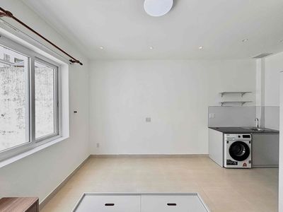 A large window studio full of private washing machines